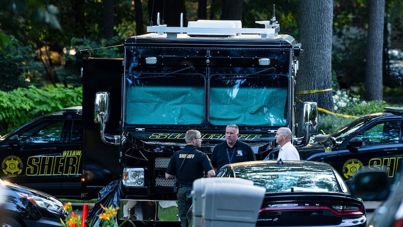 Officials say man killed wife and 6 kids, then himself, before all were found in Michigan home fire