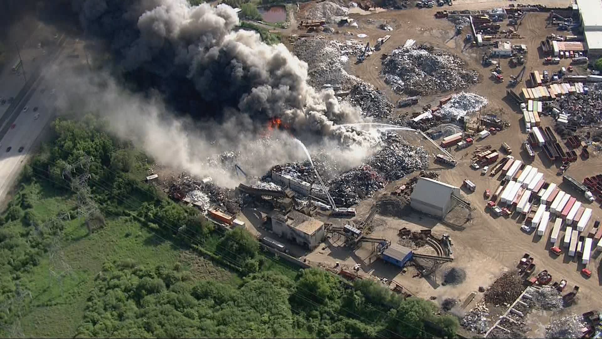 Brampton crews battling large fire at scrap yard