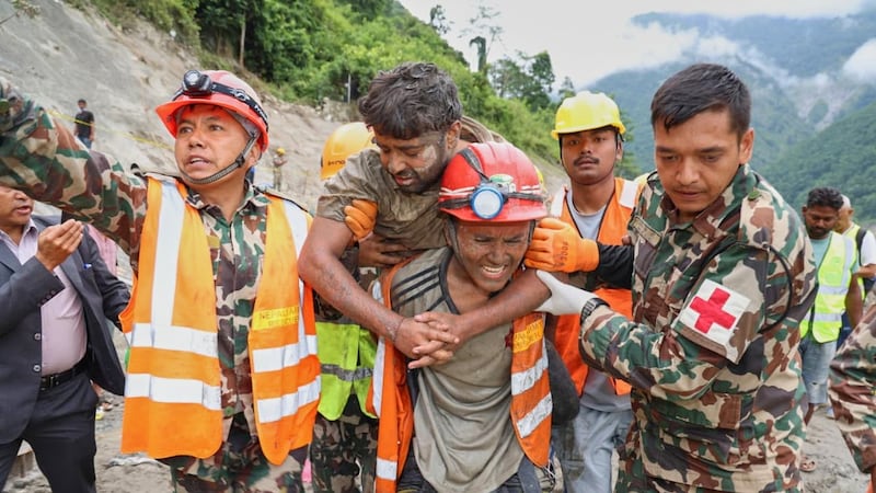 Rescuers pull 2 trapped workers from a hydropower tunnel 9 days after Nepal floods