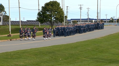 Members of the military march in a parade.