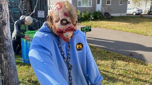 The Halloween display outside of Kevin Whittaker's haunted house featuring many decorations. (CTV/Derek Haggett)