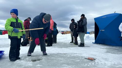 Anglers of all ages are pictured fishing through the ice for the Family Day fishing event at Dominion Park in Saint John, N.B. (Avery MacRae / CTV Atlantic)