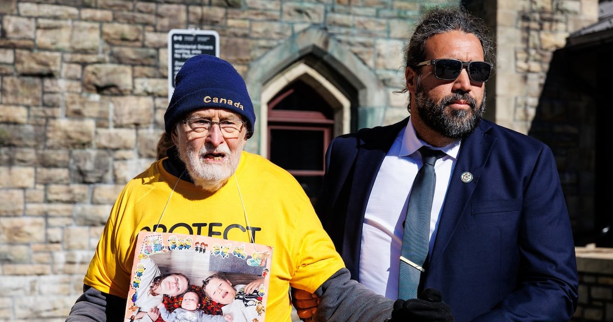 Seniors Climate Witness member Eric Schiller of Ottawa is arrested after attempting to deliver climate impact documents to MPs on Parliament Hill in Ottawa on Tuesday, Sept. 22, 2026. THE CANADIAN PRESS/Keito Newman