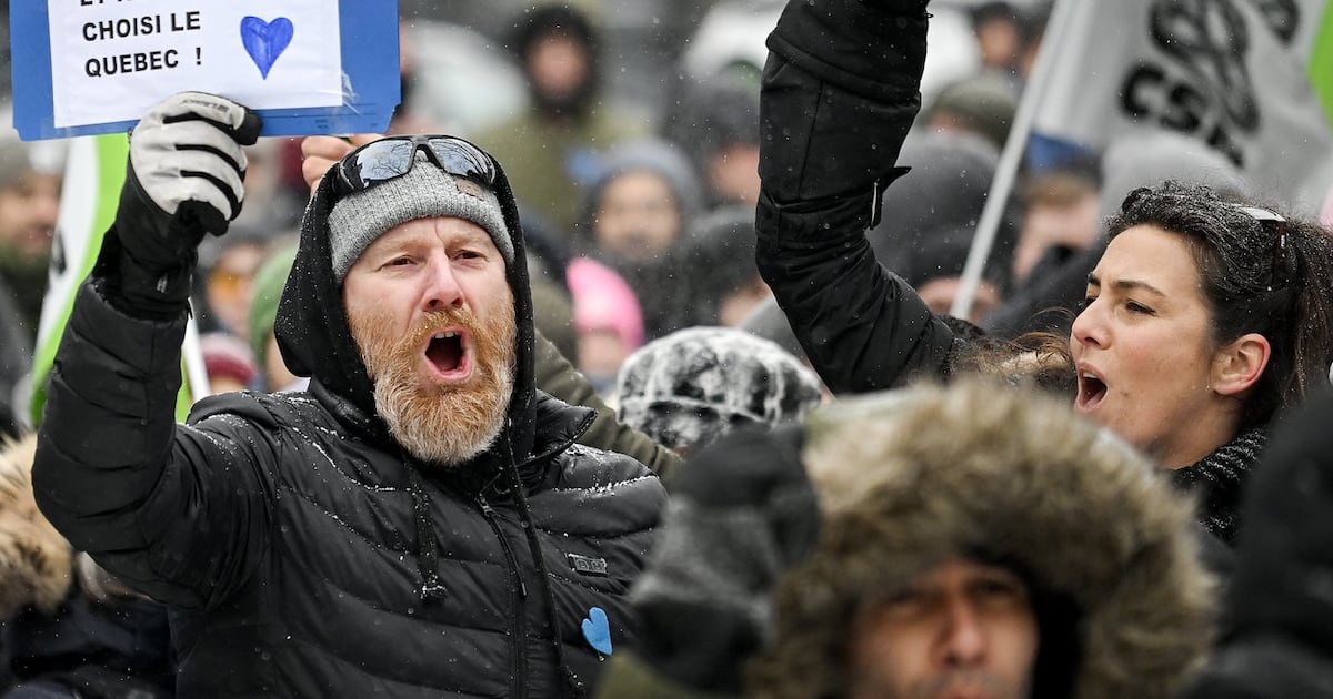 Protesters at a protest against the elimination of the Quebec Experience Program (PEQ) in Montreal on Saturday, Feb. 7, 2026. (Graham Hughes/The Canadian Press)