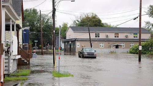 A flooded street is pictured.