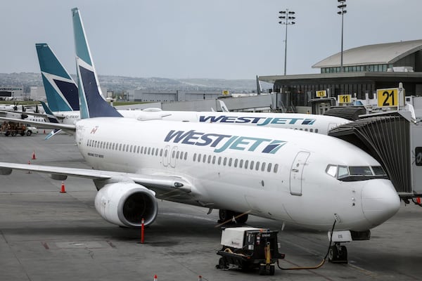 WestJet looking to return to normal operation after tech issue caused flight delays