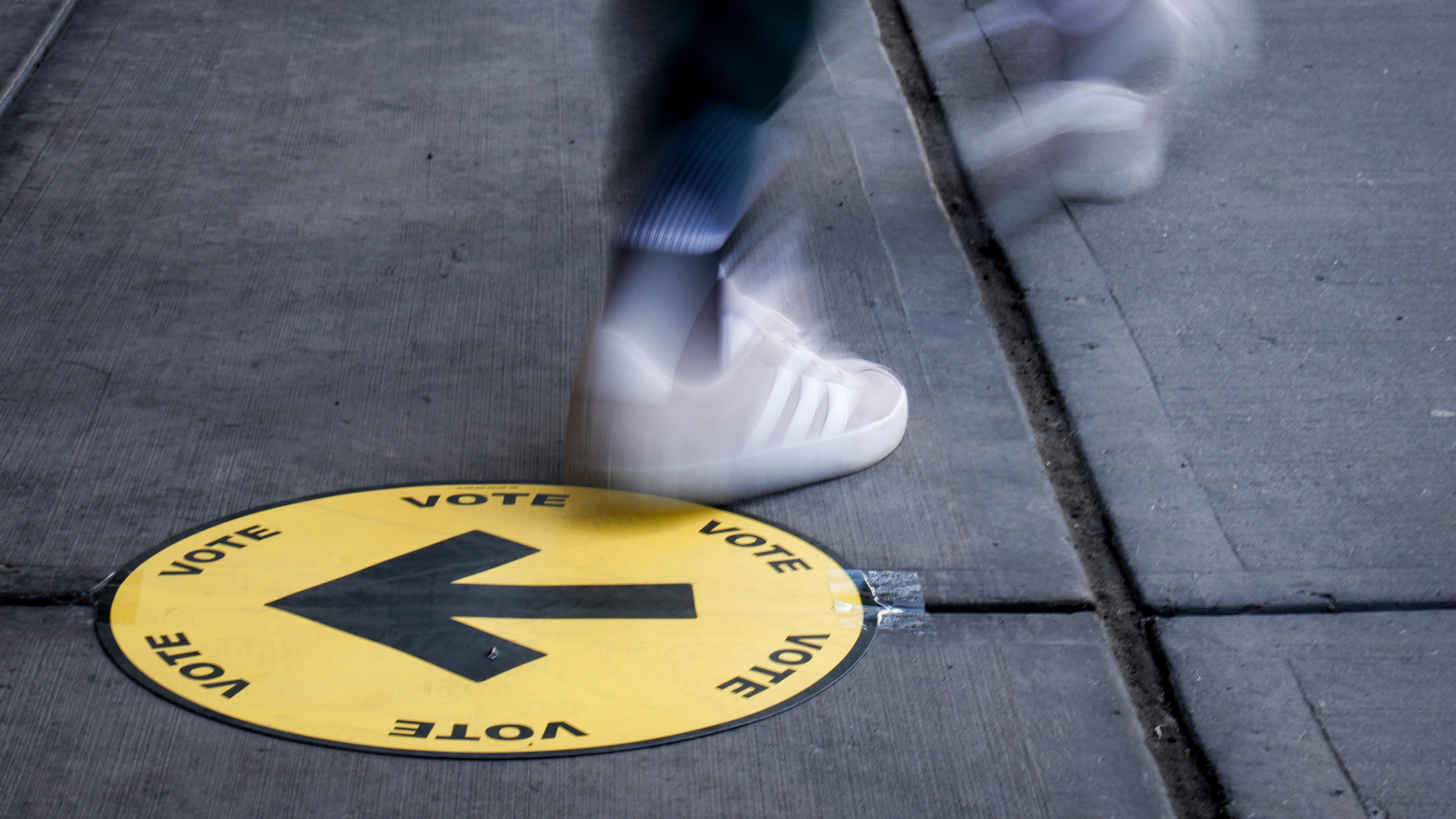 A voter leaves a polling station after casting a ballots in the federal election in Calgary, Monday, April 28, 2025. (THE CANADIAN PRESS/Jeff McIntosh)