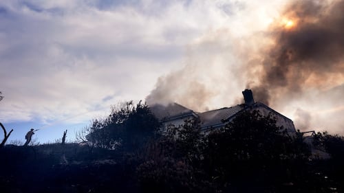 Fire crews battle Southern California blaze that burned 6 homes, led to the evacuation of 16,000