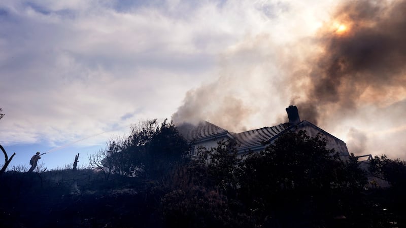 Fire crews battle Southern California blaze that burned 6 homes, led to the evacuation of 16,000