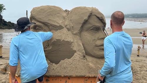 Master sculptors Dan Belcher and Thomas Koet carefully preserve and edge away sand to create their masterpiece. (CTV/Avery MacRae)