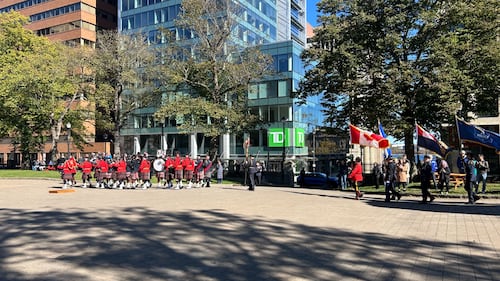Officers stand at a memorial service.