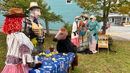 Scarecrows are pictured.