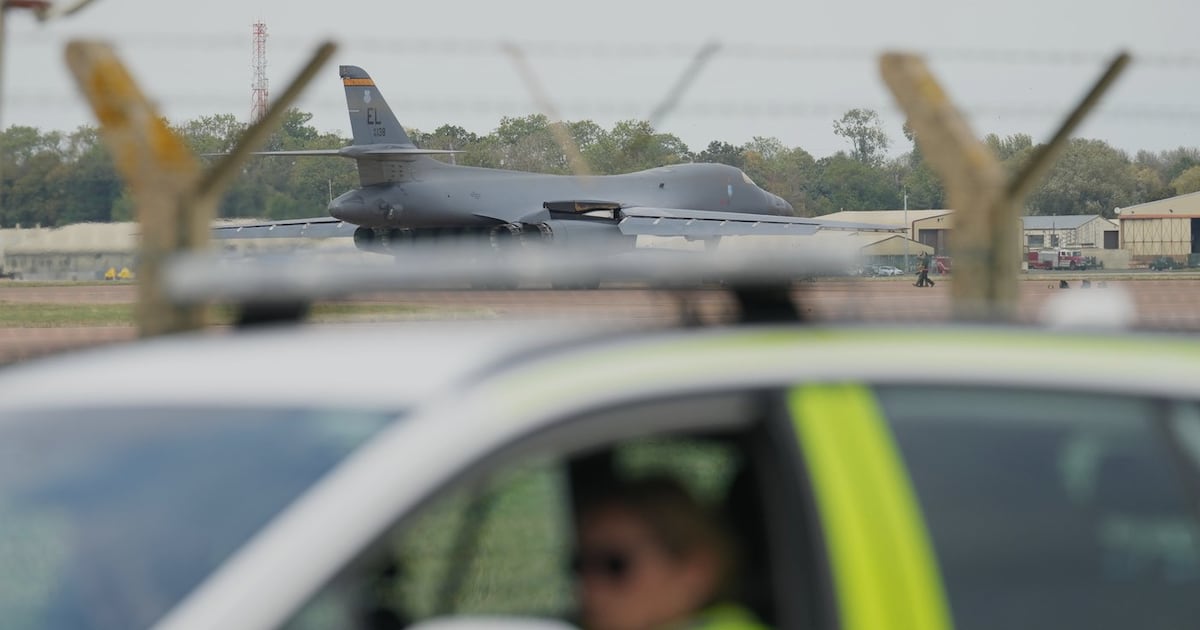 A B1 bomber prepares to take off as police officers guard a checkpoint near RAF Fairford air base, in Fairford, England, Tuesday, Sept. 29, 2026. (AP Photo/Alastair Grant, File)