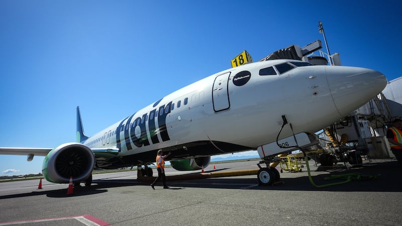 A man and woman stripped while on board a flight. Now they're facing thousands in fines