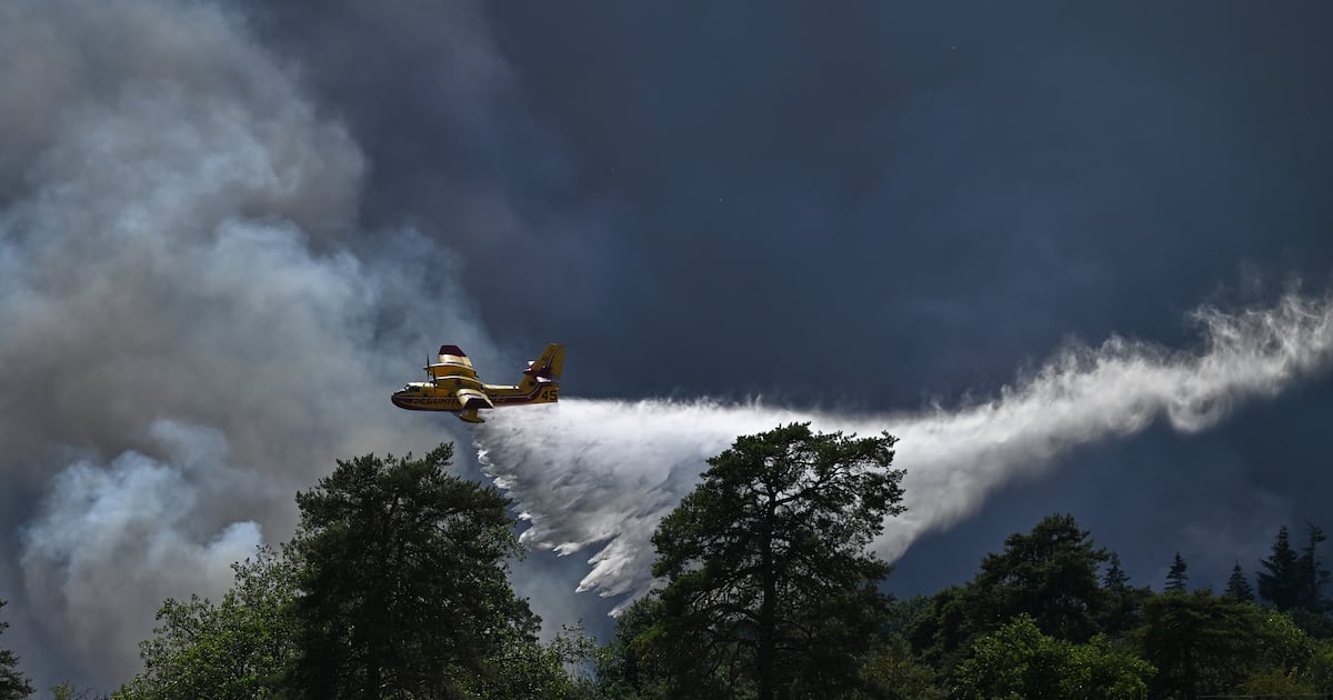 Blaze near Paris burns on as heatwave tightens across Europe