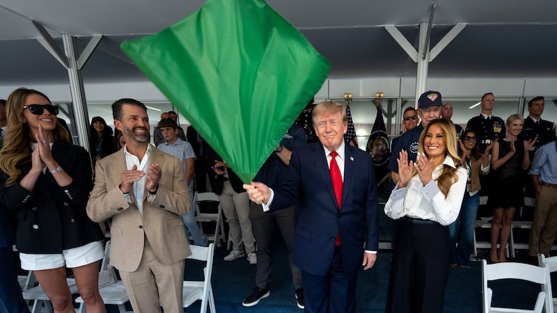 Trump waves the green flag to start the IndyCar race as drivers zoom through Washington's streets