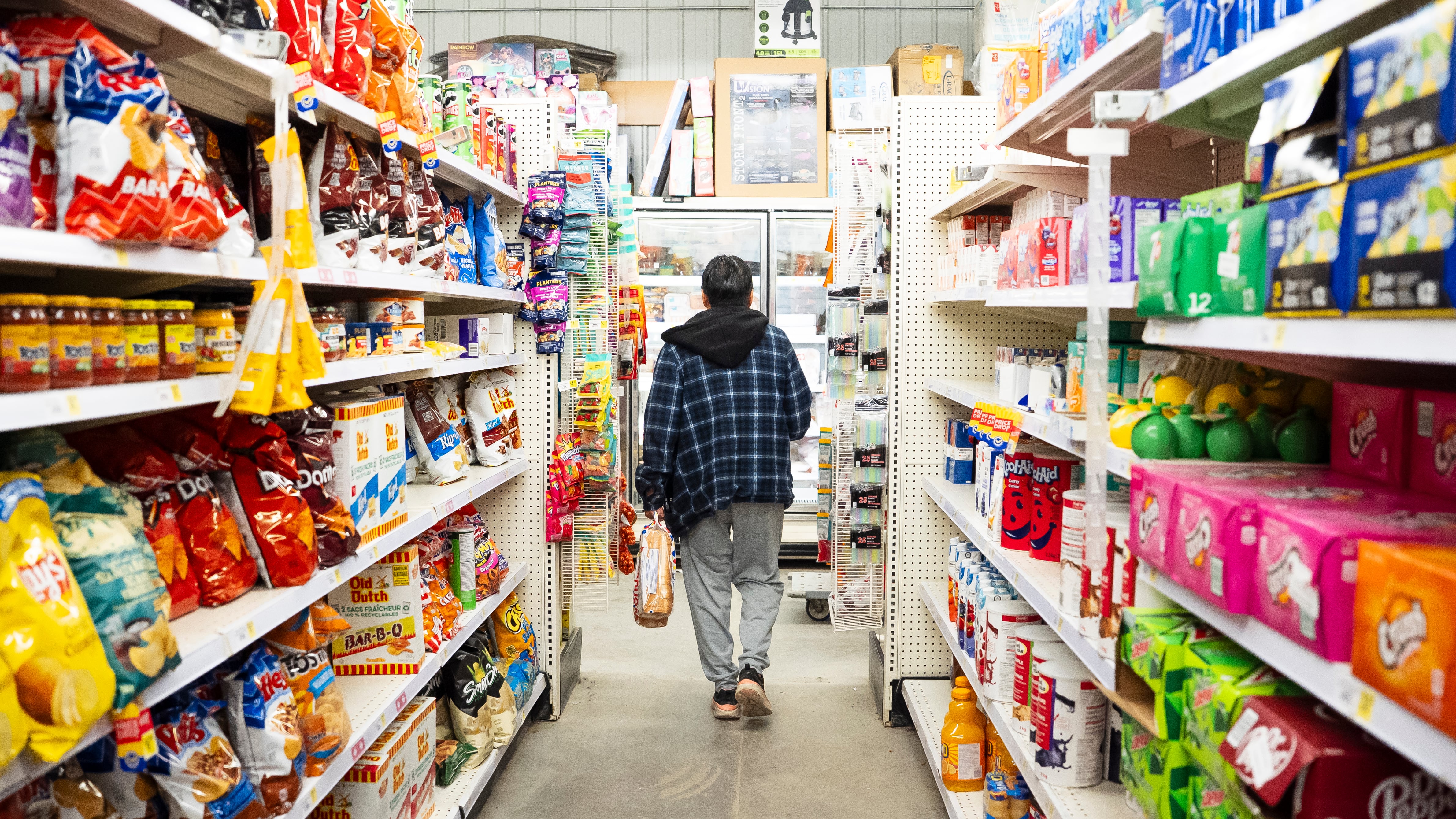 A person shops at a grocery store in Neskantaga, Ont., on Oct. 26, 2025. (Christopher Katsarov / The Canadian Press)