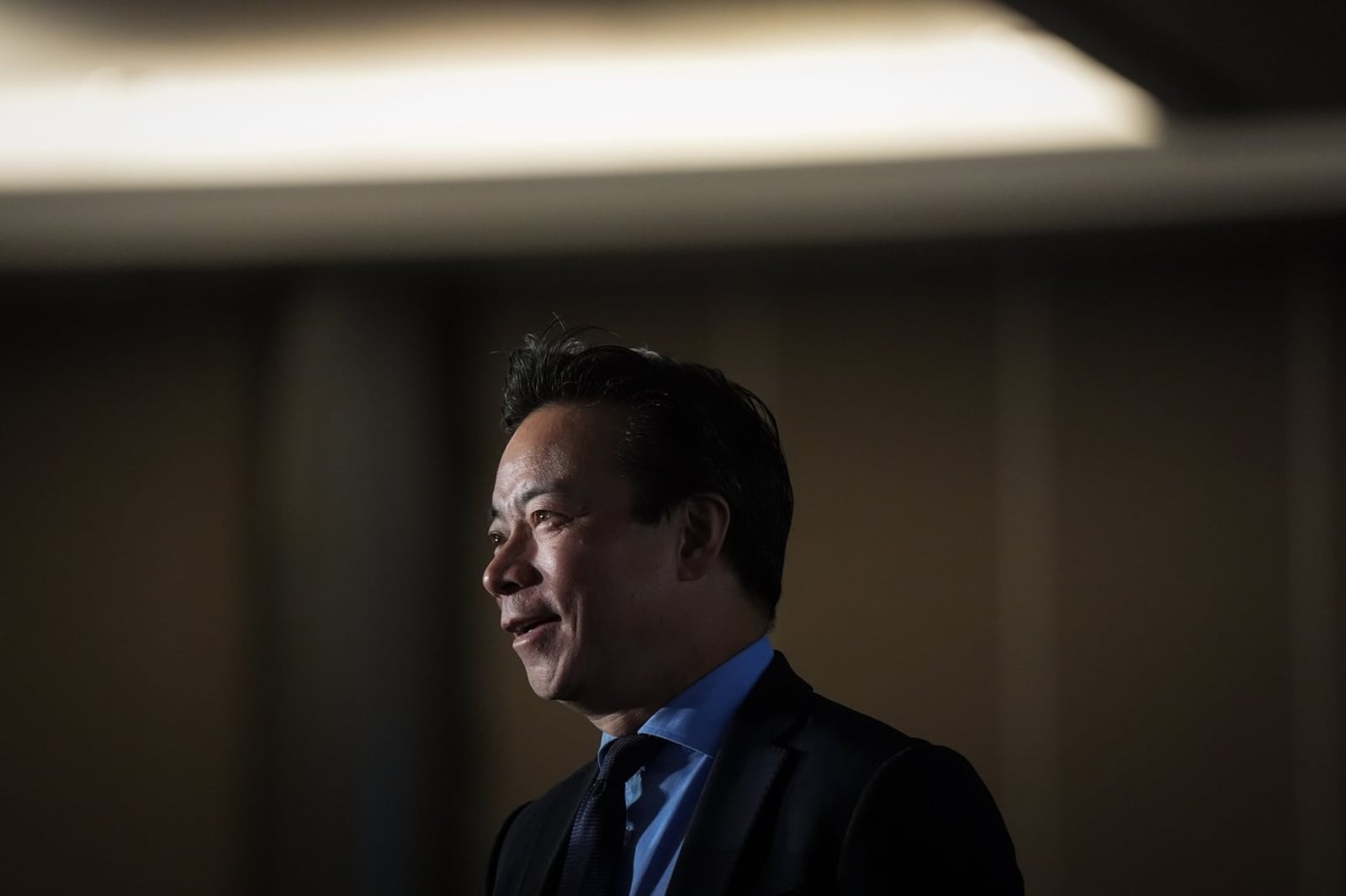 Vancouver mayor Ken Sim in a dark suit walks toward the podium at the Greater Vancouver Board of Trade State of the City address on April 8, 2026