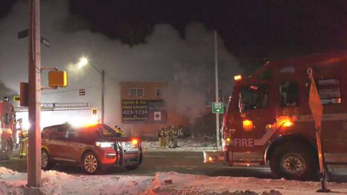 Edmonton firefighters work at 10328 97 Ave. the morning of Feb. 23, 2026. (Evan Klippenstein / CTV News Edmonton)
