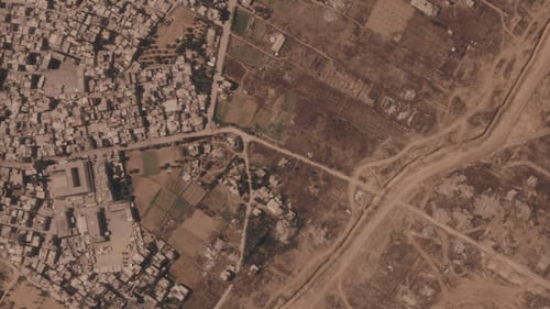 Israel is building a miles-long earthen barrier inside Gaza, entrenching its division