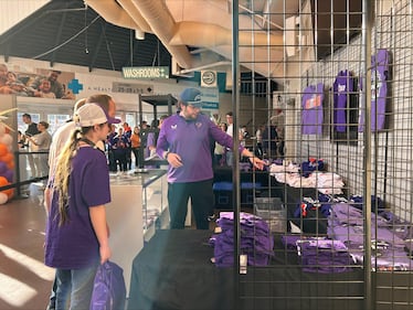 Fans purchase merchandise at the finals. (CTV/Marnie Ells)