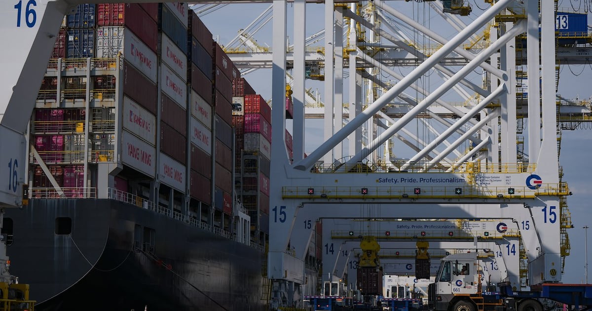 Containers are unloaded from the Yang Ming Throne container ship at Deltaport, at Roberts Bank in Delta, B.C., on Thursday, July 16, 2026. THE CANADIAN PRESS/Darryl Dyck