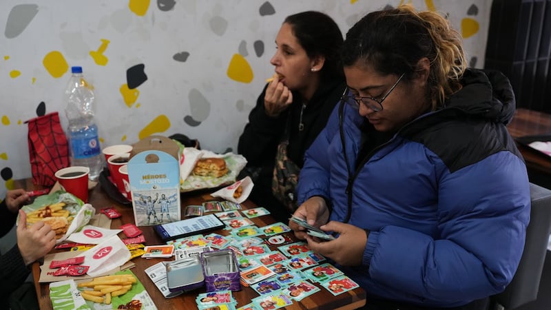 Argentine plazas buzz with World Cup sticker trading fever