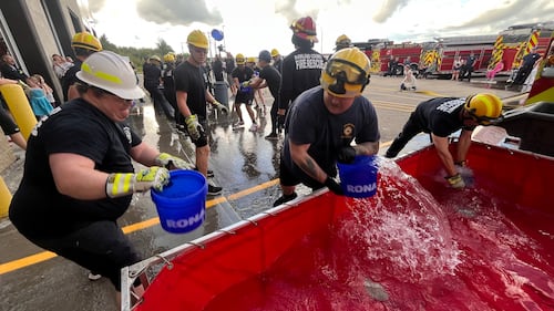Parkland County firefighters compete in the inaugural Battle for the Bell skills competition in Acheson, Alta., on Aug. 11, 2026. (Dave Mitchell / CTV News Edmonton)