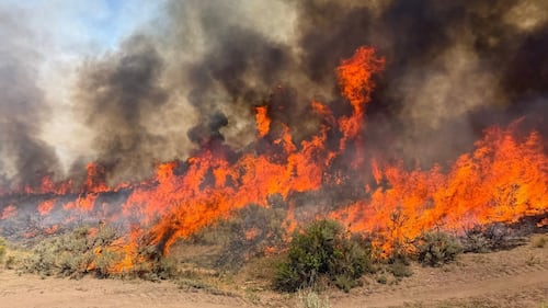 A helicopter battling a Utah wildfire crashes as a blaze kills dozer operator in Oregon