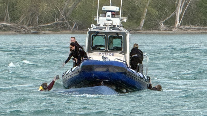 WATCH: Two people rescued after a boat capsizes near Peche Island