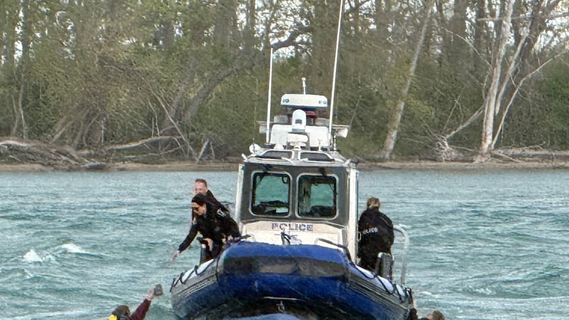 WATCH: Two people rescued after a boat capsizes near Peche Island