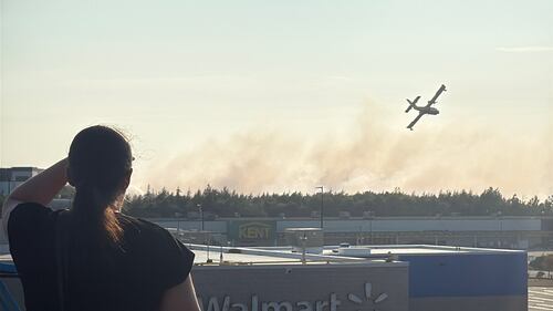 A fire is pictured burning in the  Julius Boulevard and Dugger McNeil Drive area of Bayers Lake, N.S., on Aug.12, 2025. (CTV Atlantic / Callum Smith)