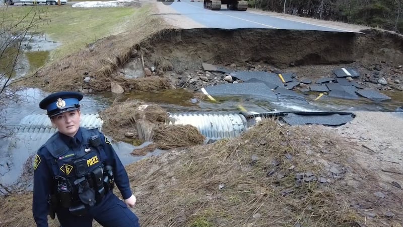 Road in Minden Hills crumbles as flooding continues