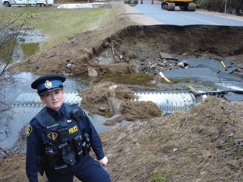 Road in Minden Hills crumbles as flooding continues