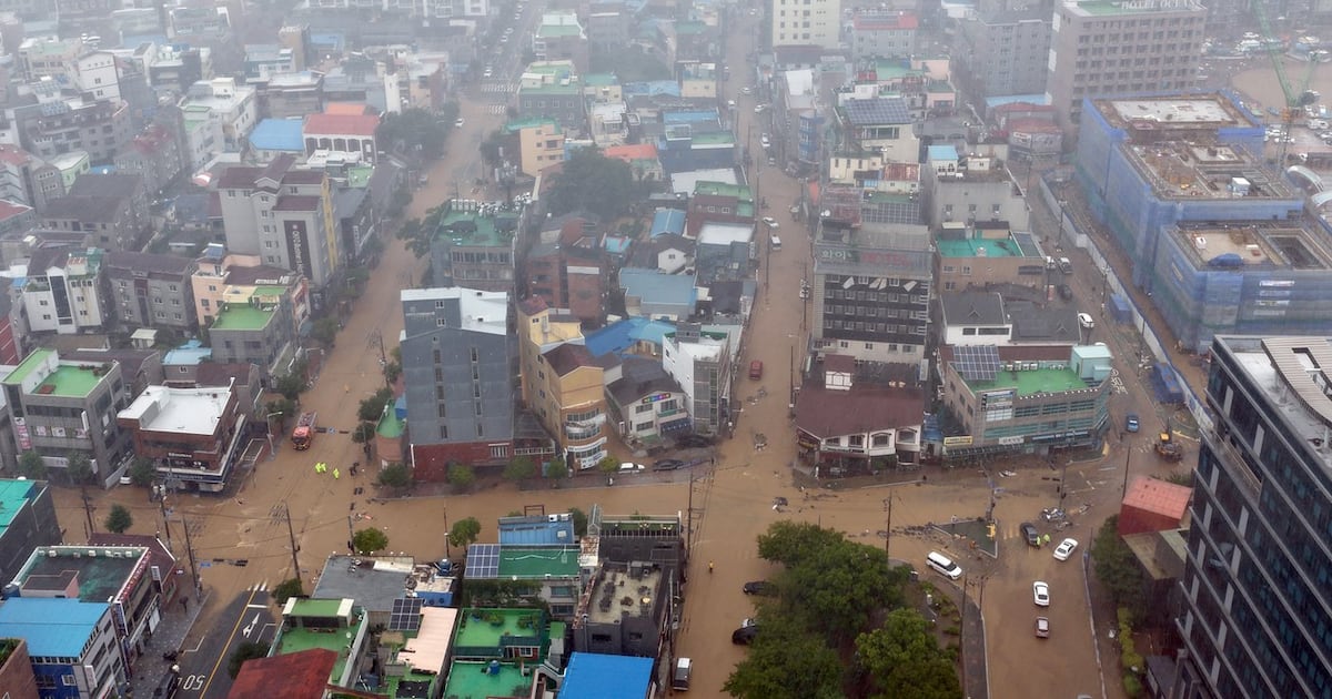 Heavy rains kill 1 in South Korea and flood major streets in Philippines
