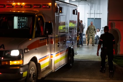 Emergency crews and military personnel at the Wainwright Health Centre as injured military members are treated after a fire at CFB Wainwright, outside of Wainwright, Alta., on Saturday, Oct. 17, 2026. THE CANADIAN PRESS/John Ulan