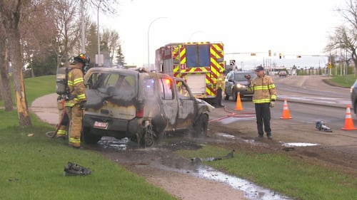 Firefighters put out a vehicle fire on eastbound 107 Avenue near Mayfield Road in Edmonton the morning of May 15, 2026. (Evan Klippenstein / CTV News Edmonton)