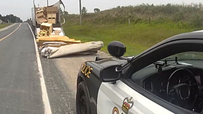 Truck driver charged after transport truck strikes railway bridge in Oxford County