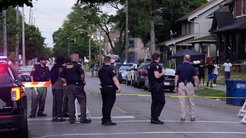 Police search for suspects in Ohio shooting that wounded 12 near a street festival