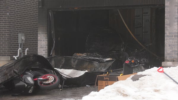 Fire damages garage and vehicle inside in north London