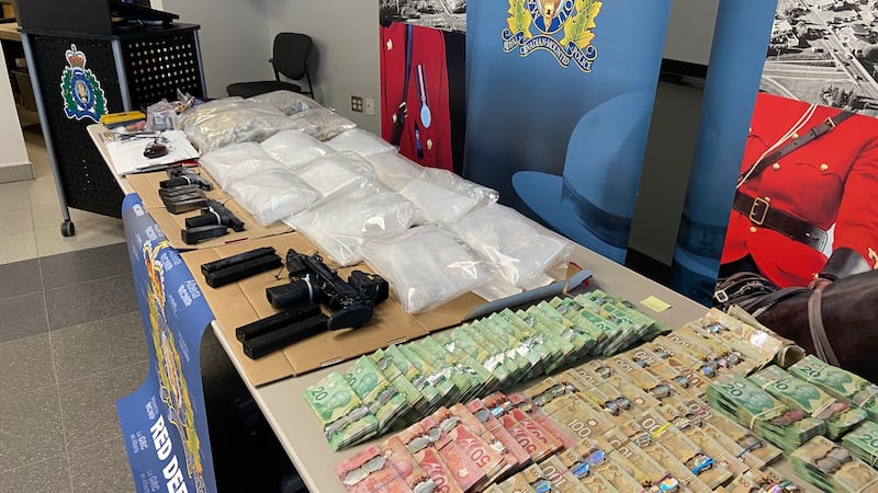 Pair charged in central and southern Alberta after RCMP drugs, weapons investigation