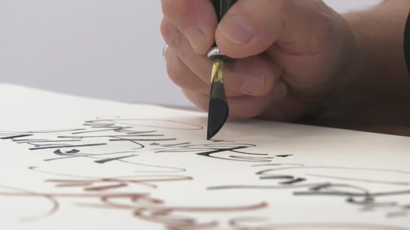 Calgary calligraphers' love of their craft on display at local library