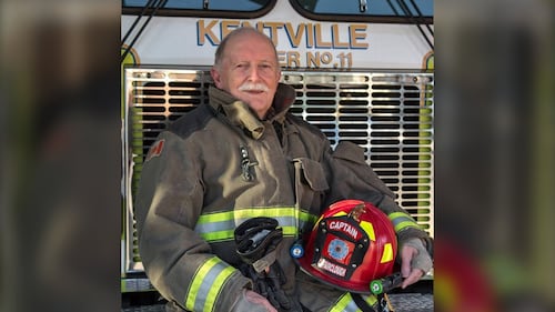 Clem Fairclough is pictured in uniform in front of a fire truck. (Courtesy of Brian Taylor)