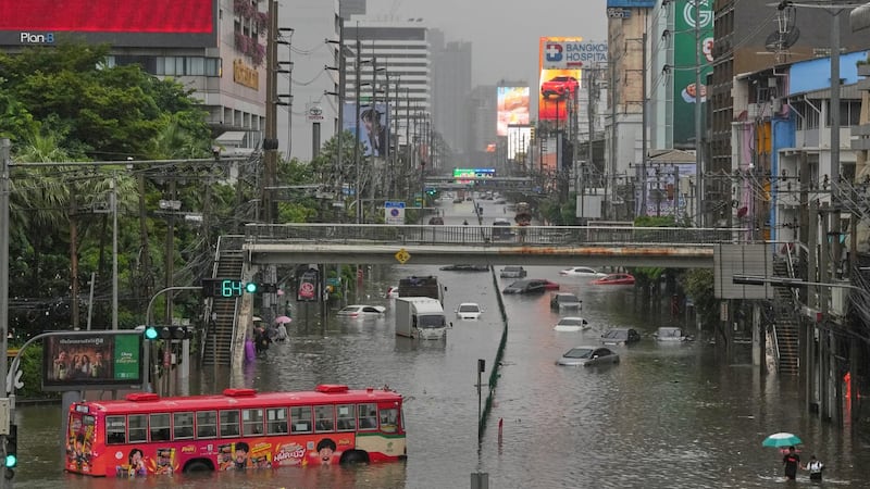 Heavy rain and flooding in Bangkok disrupts traffic and prompts evacuations