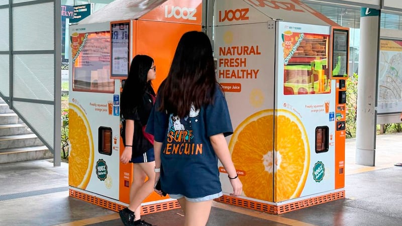 French teen charged in Singapore over a vending machine straw-licking video