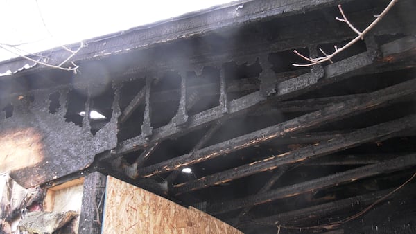 Crews fighting a house fire in Byron navigating around holes in the floor