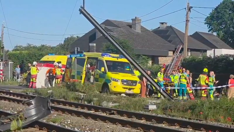 4 dead, 5 hurt in a crash between a train and a school bus, Belgian officials say