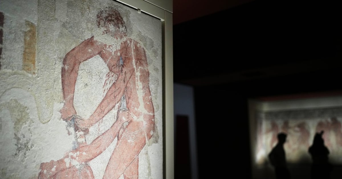 Italy displays paintings from an ancient Etruscan tomb, its latest ...