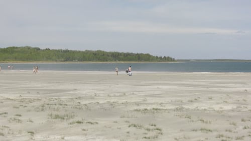 People walk at Aspen Beach Provincial Park, located on Gull Lake, Alta., on May 25, 2026. (Darcy Seaton / CTV News Edmonton)