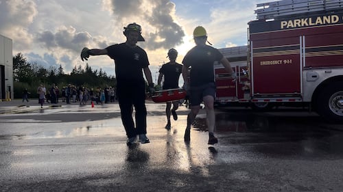 Parkland County firefighters compete in the inaugural Battle for the Bell skills competition in Acheson, Alta., on Aug. 11, 2026. (Dave Mitchell / CTV News Edmonton)